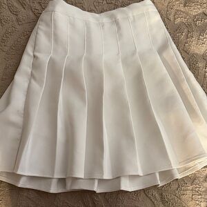 Elegant White Pleated Skirt with shirts underneath